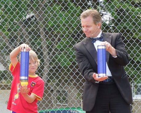 Calgary magician Richard Rondeau performing at a company picnic