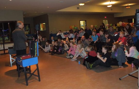 Community activity featuring Richard Rondeau magician