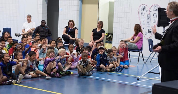 Children react to a performance by Calgary magician Richard Rondeau